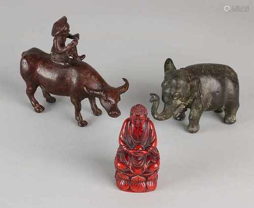 Three Oriental figures. 20th century. One time Buddha horn? One time bronze elephant. One time