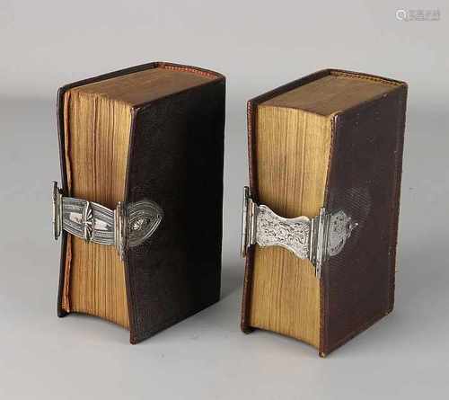 Two Bibles with silver clasp. Two bibles, The New Testament, with silver clasps with carvings. MT .: