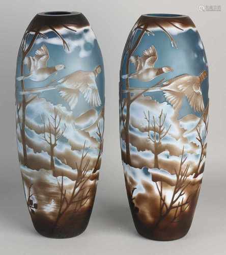 Two Gallé style glass vases with ornamental pigeons landscape decor. 21st century. Size: H 37 cm. In