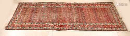 Ancient Persian carpet in the color brown / black / cream. Size: 237 x 95 cm. In reasonable