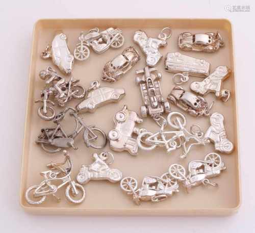 Lot 19 silver charms, 835/000, in the form of cars, bicycles and motorbikes. 2-3cm. Total approx