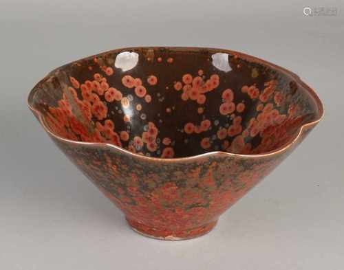 Large Chinese porcelain bowl with gold-brown iridescent glaze. Molded rim. Size: 9.5 x 19 cm dia. In