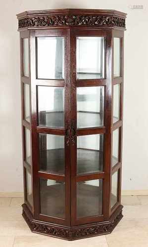 Two-door cabinet having octagonal display case teak faceted glass and chess pieces cut figures.