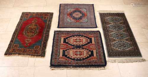 Four old Persian rugs, diverse, floral. Size: 63-97 cm. In good condition.