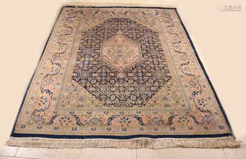 Hand-knotted Persian rug. Light color, blue border and floral decor. Size: 235 x 170 cm. In fair /