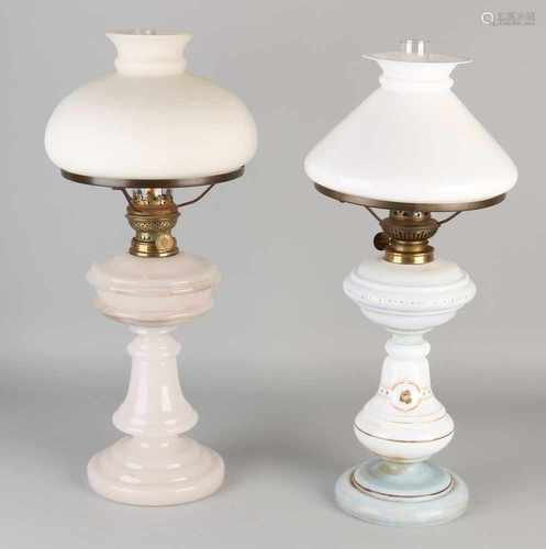 Two antique opaline glass table kerosene lamps. Circa 1900. Dimensions: H 50 / ø 20 cm. In good