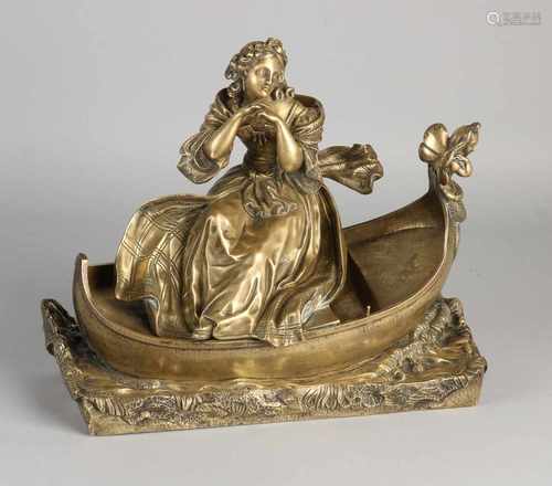 Antique bronze pendulum figure. Woman in boat. Size: 23 x 10 cm basement. In good condition.