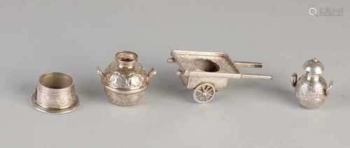 Four silver miniatures, 800/000, fitted with a cart, two jars and a ring engraved. Total about 110.9