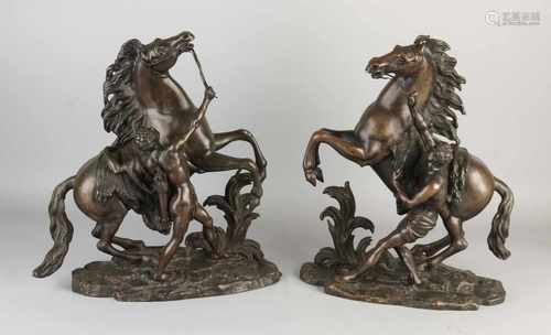 Two antique bronze Marly Horses to G. Cousteau. Approximately 1900. Size: 38 x 36 x 14 cm. In good