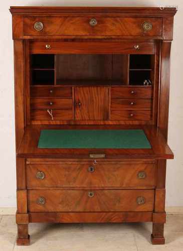 Dutch mahogany Empire secretary with beautiful inner life and original brass ferrule. Circa 1820.