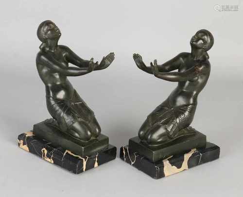 Two original French Art Deco bronze bookends with marble base. By Fayral. 1892 - 1962. One arm