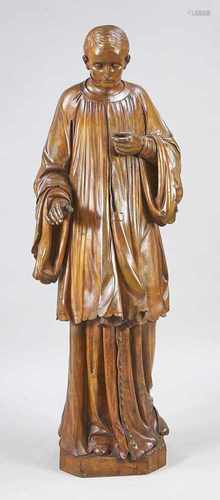 19th Century wooden statue, depicting a young saint with mantle. 124cm high in good condition.