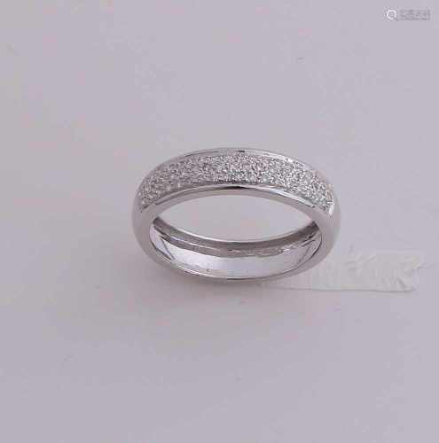 White gold ring, 585/000, with diamond. Wide ring having at the top 3 rows of small brilliant-cut