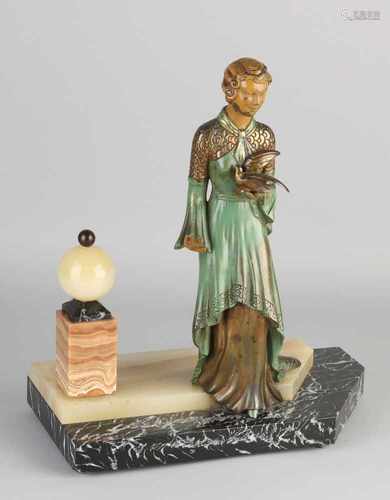 Deco Art Fig. Circa 1920. Bronze cold painted lady dove. Mounted on basement of marble / onyx. Size: