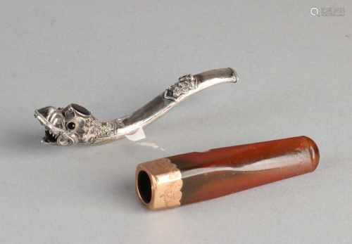 Two cigarette holders, a silver pipe, 925/000, with dragon and garnet and a square pipe with