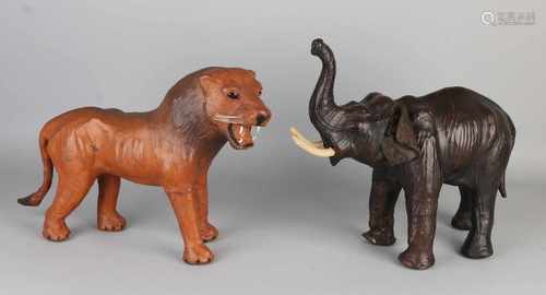 Two leather animals with glass eyes. + Elephant lion. 20th century. Size: 33-34 cm. In good