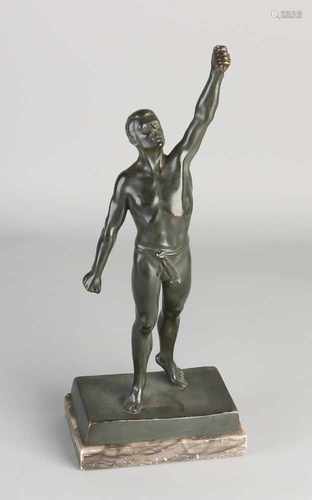 Antique bronze figure. Circa 1920. Male athlete. Placed on a marble base. Lacks something in hand.