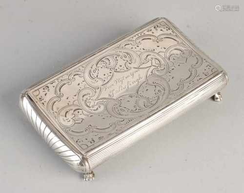 Silver tobacco box, 833/000. Rectangular box tobacco, hip model, placed on four claw feet and at the