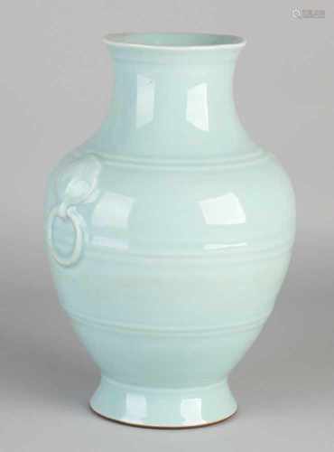 Light blue glazed Chinese porcelain vase with bottom mark and reprocessed rings. Dimensions: H 26