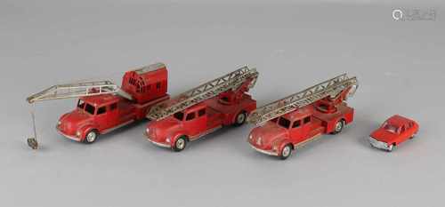 Four German metal toy cars. Three times Märklin fire brigade vehicles. One time Schuco Renault.