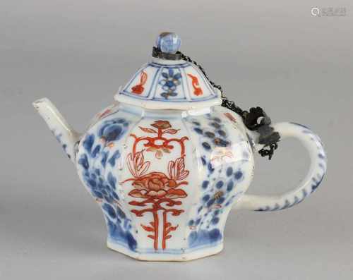 18th Century Chinese porcelain octagonal teapot with floral decor. Chip spout. Size: 10.5 x 15 x 8.5