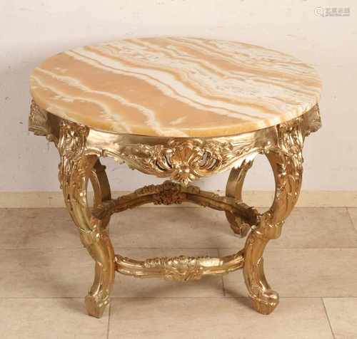 Gold-colored Baroque-style coffee table with alabaster table. Chip magazine. 20th century.