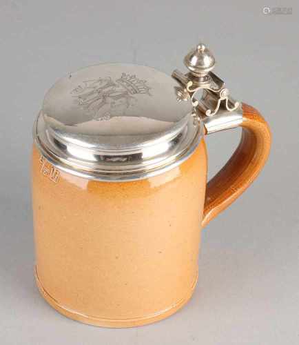 Silver tankard with valve 800/000. Earthenware tankard with silver valve fitted crowned monogram