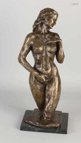 Bronze women figure in black marble base. 21st century. Dimensions: 42 cm. In good condition.