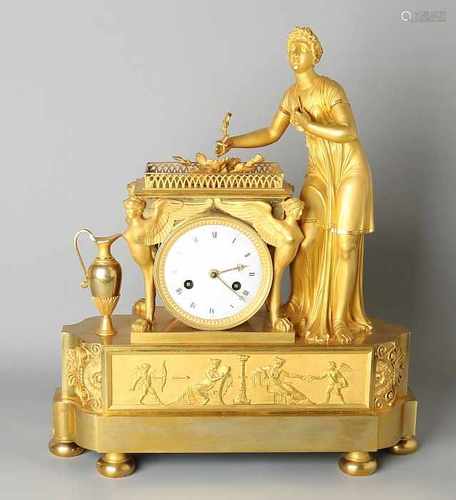 Capital French Empire ormolu bronze mantel clock lady with flower in her hand, ampfora, winged