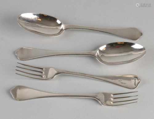 Two sets of antique silver place settings. Lepelbak with rat tail and all steal with brace-shaped