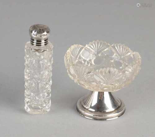 Two parts with silver, 835/000, a crystal bottle with grinding and silver domed cap, slightly dented