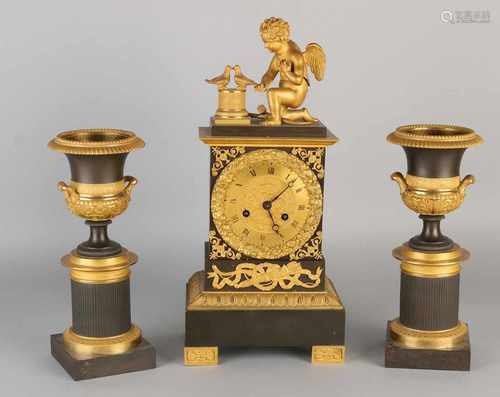 Rare gilt bronze bell couple with original crater vases. Clock with Cupid and peace doves. Circa