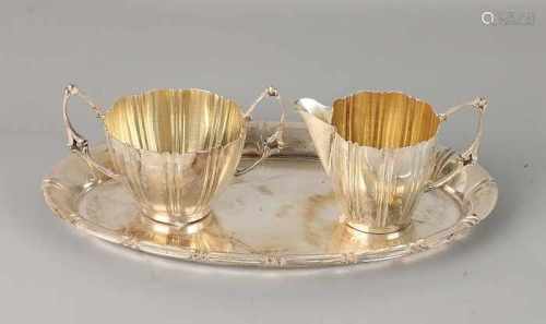 Silver cream marshall sheet 800/000, oval tray with ribs provided with a milk jug and suikerbak,