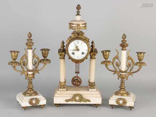 Three-piece white marble mantel clock French couple with gilded bronze. Circa 1880 Louis Seize