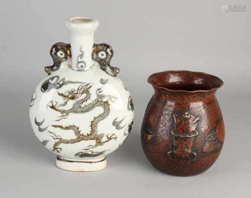 Twice China. One buyer driven vase with objects and characters. One pilgrim porcelain bottle with