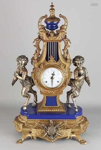 Italian imperial bronze mantel clock with fauns and blue porcelain. 21st century. Eight day-