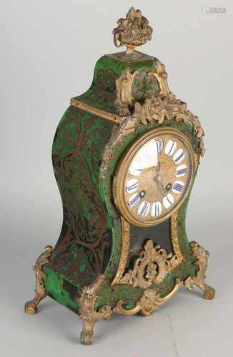 19th Century French boulle table clock with tortoise adhesive and bronze decorations. Circa 1870.