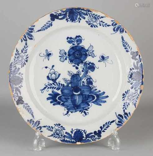 Large 18th century Delft Fayence decorative plate with floral decoration. 