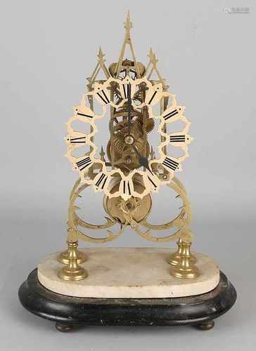 Antique English brass skeleton clock with fusee. On wood with alabaster basement. Circa 1880.