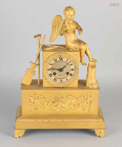 18th Century French Empire ormolu bronze mantle clock with Cupid and flower. Circa 1820. Eight day-