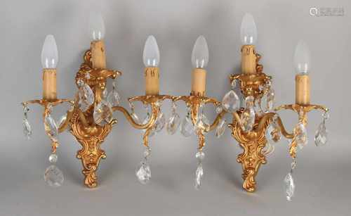 Two plated brass wall sconces with crystal icicles. 20th century. Size: 34 x 30 x 20 cm. In good