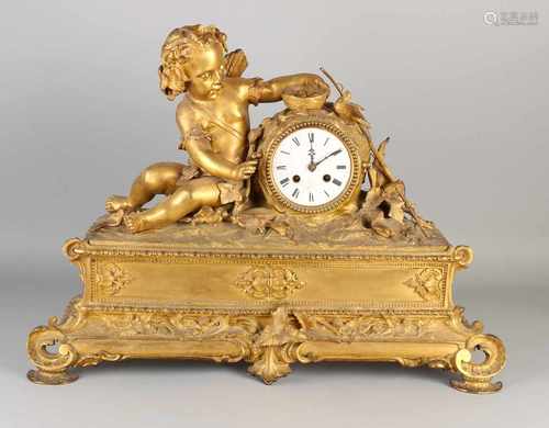 Large gilt bronze mantle clock with Cupid. Circa 1860. France. Eight day-movement, half-hour battle,