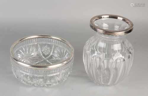 Two parts crystal with silver, a convex vase with a ground work with a smooth edge silver, 925/