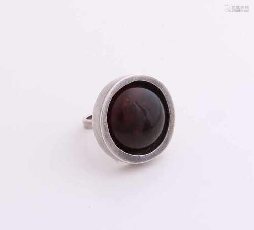 Silver ring, 925/000, with succinic. Ring occupied with a round head with a round amber. ø 27 mm