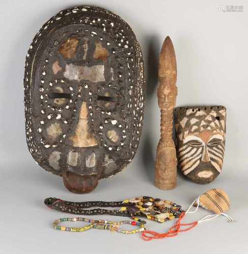 6x Africa. 20th century. Comprising: Large mask with skin and shells. Small mask with polychrome.