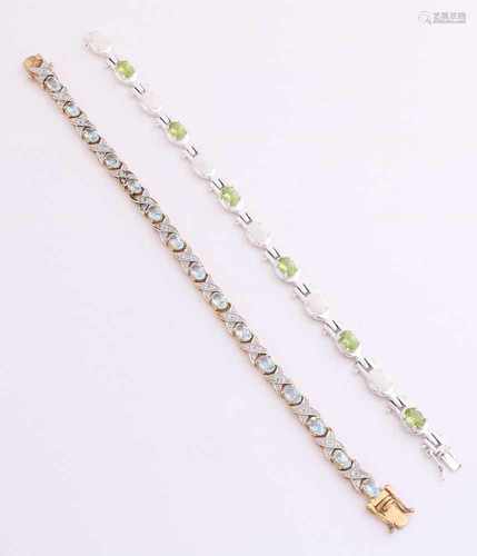 Two bracelets. 925/000, with color stones. One silver-plated bracelet features light blue stones and