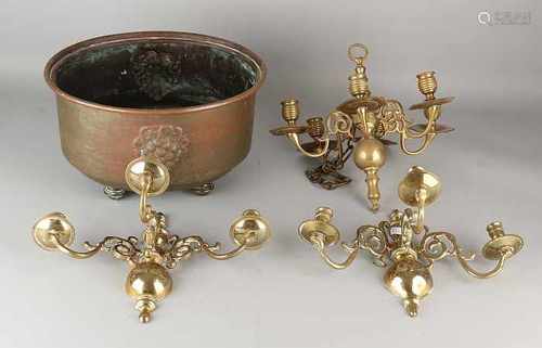 Four times antique brassware. 19th century. Comprising: Three candle candlesticks and one oval