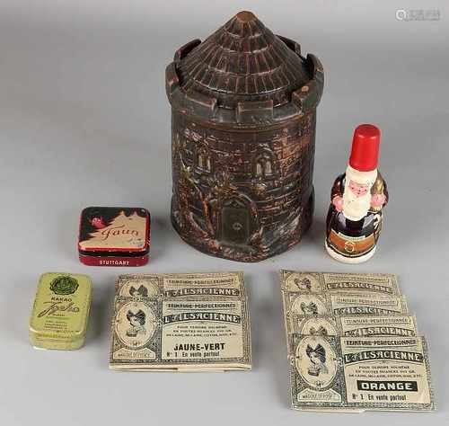 Antique tobacco jar and advertising objects. Comprising: Tabakspot terracotta chips. Liquor Bottle