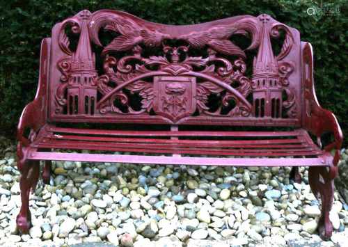 Large cast iron garden bench with arms and church decor. 20th century. Size: 90 x 80 x 140 cm. In