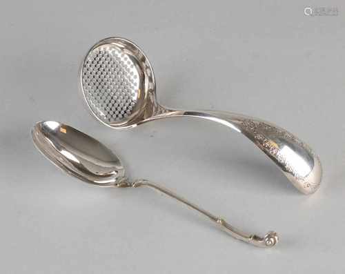 Silver dispensing spoon and cream spoon, 833/000, a dispensing spoon with a round cross-sawn